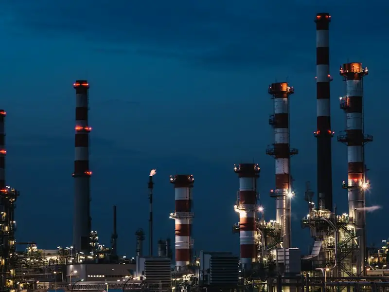 Refinery structures against the evening sky